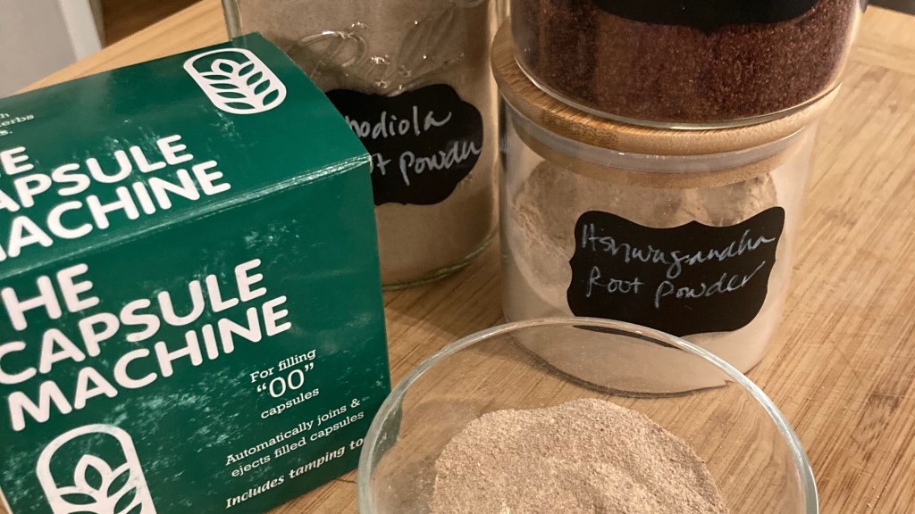 image of capsule machine, mixed ashwagandha, shisandra berry and rhodiola root