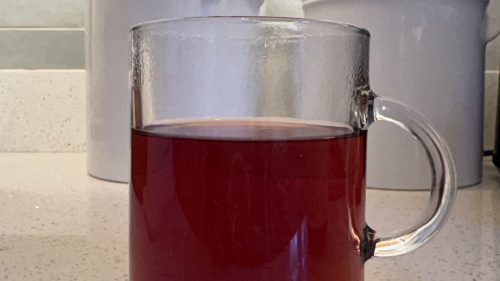 red tea in a clear glass mug